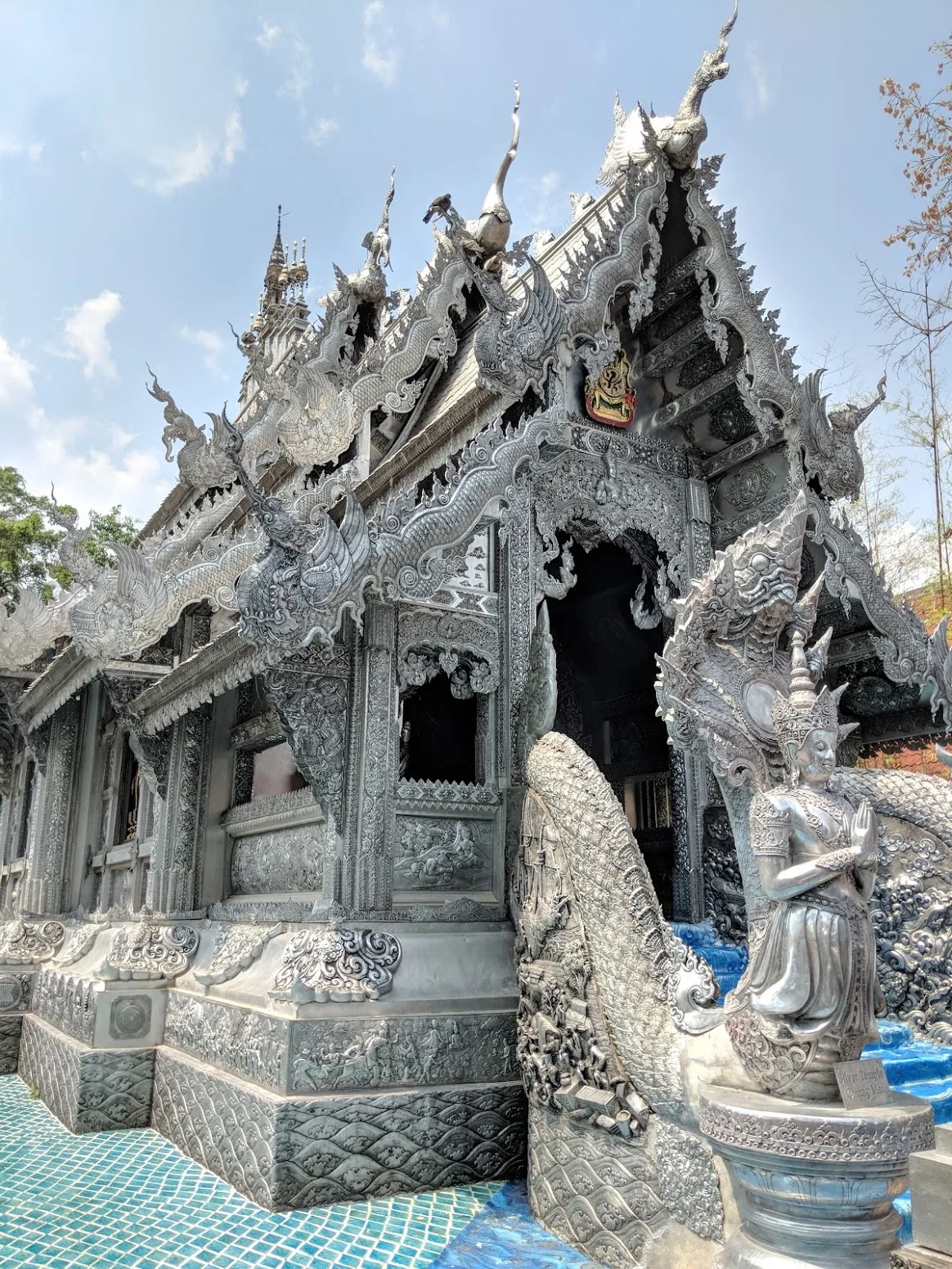 The silver-clad viharn of Wat Sri Suphan with a naga balustrade in front