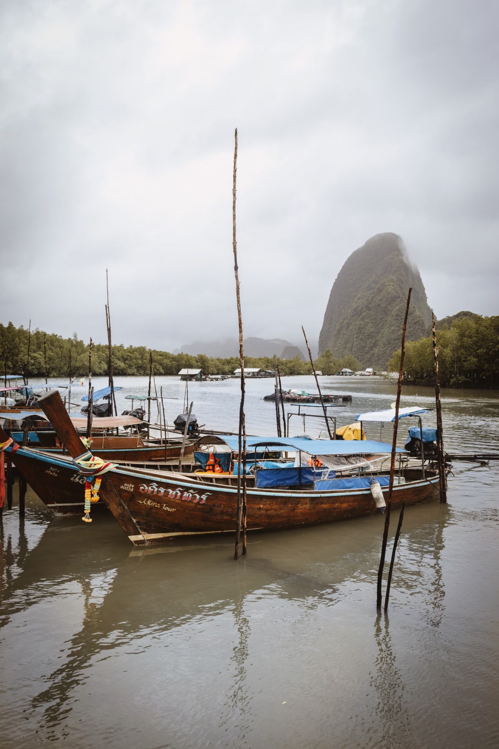 Sleepy fishing boats moored off Lanta Old Town