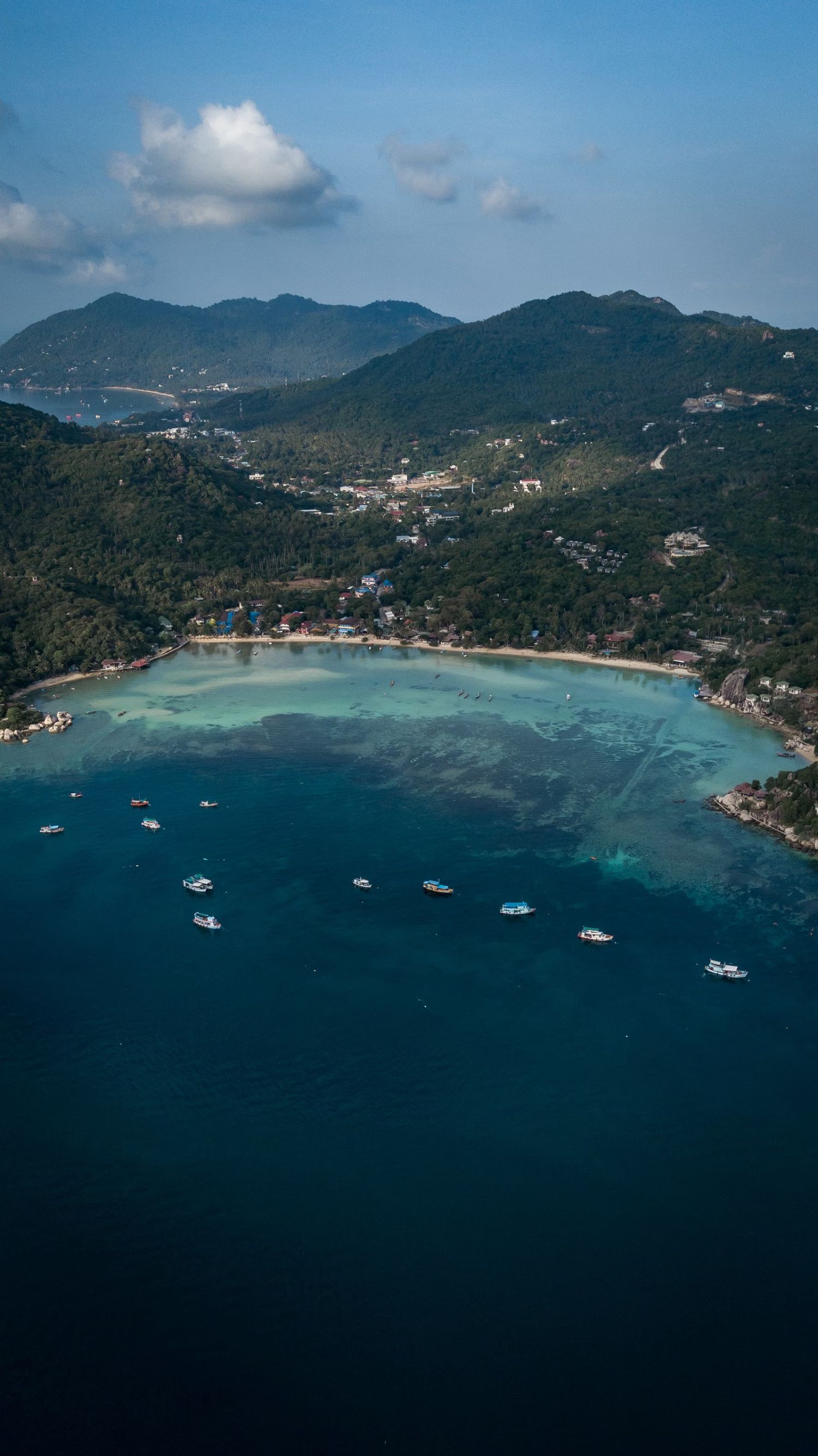 Aerial view of Koh Tao’s twin bays over turquoise water