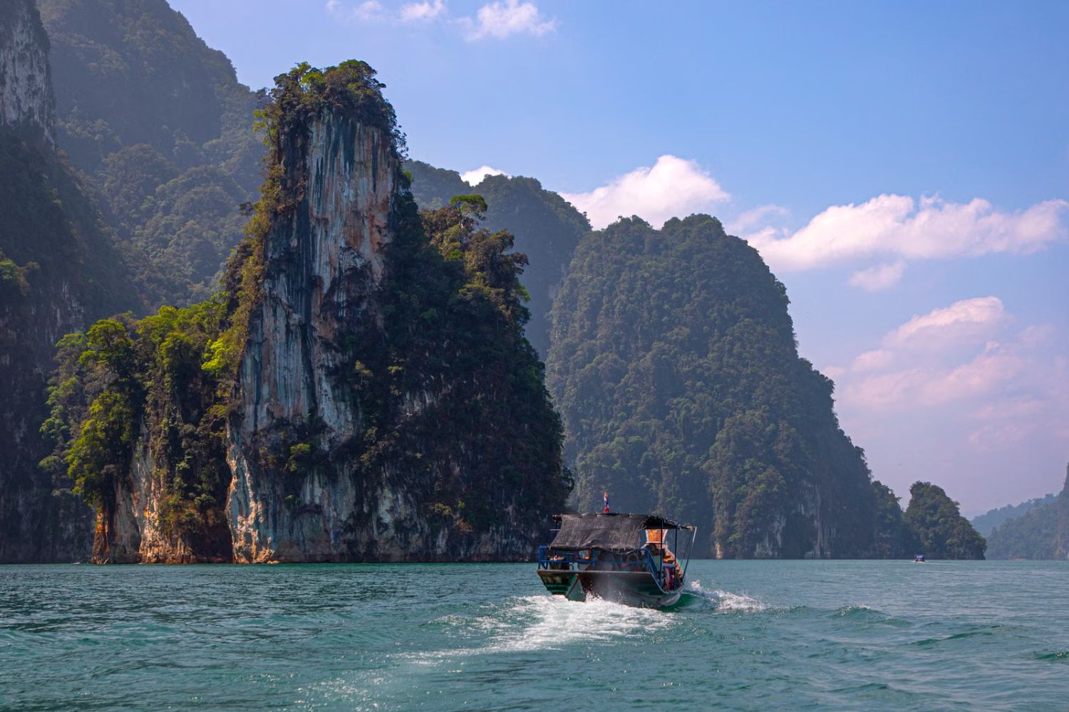 Cheow Lan Lake with a longtail boat, Khao Sok