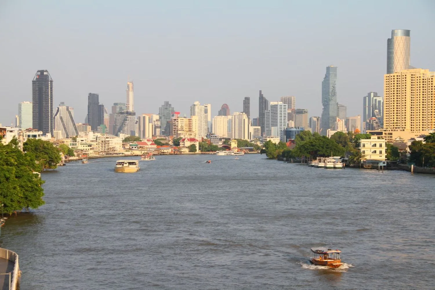 Bangkok skyline along the Chao Phraya River at dusk