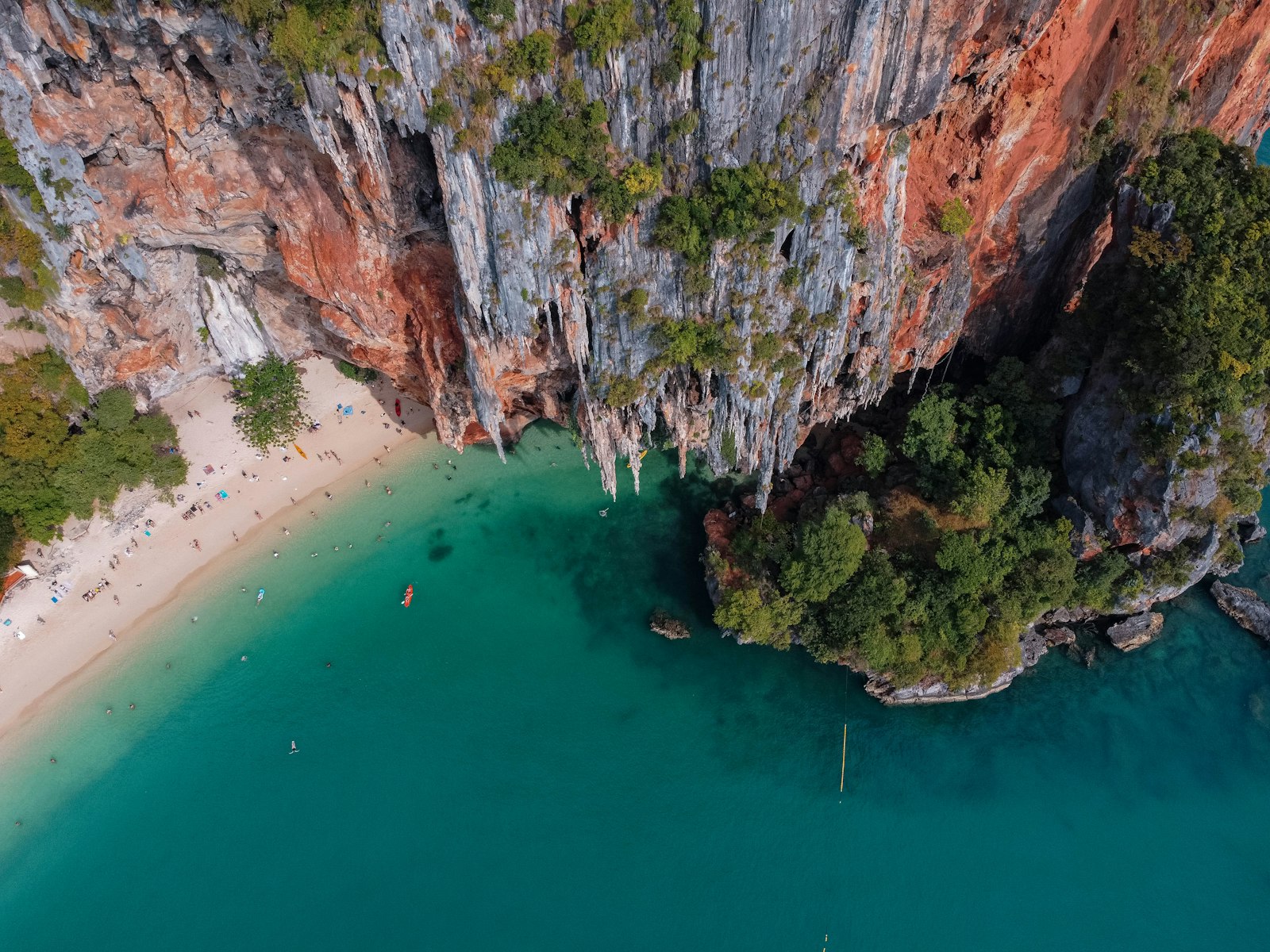 Sheer limestone climbing walls rising from the sea at Railay