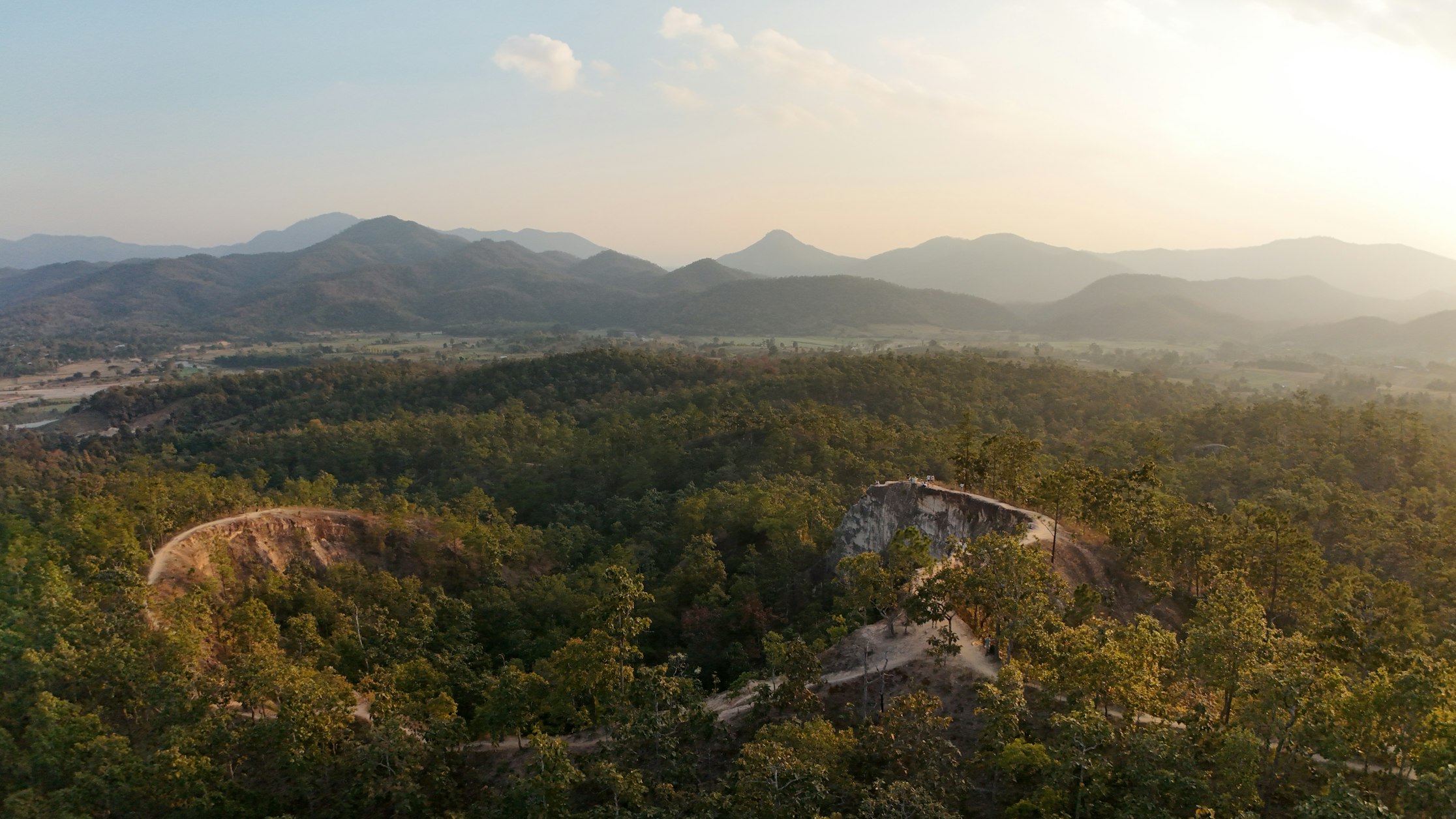 Pai Canyon red-earth ridges above the valley at sunset