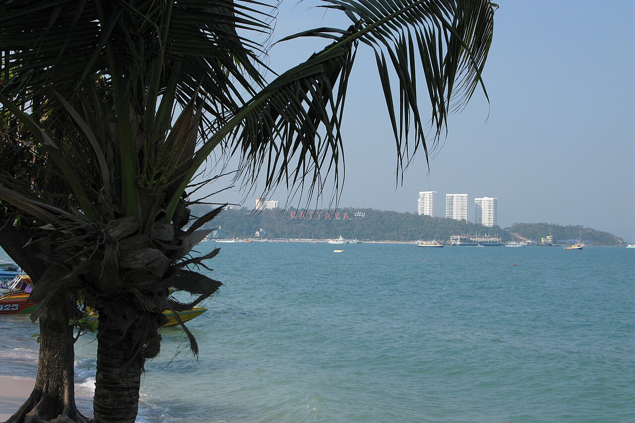 The curve of Pattaya bay with the beachfront skyline behind it